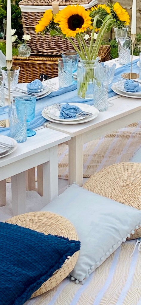 Blue picnic setup with sunflowers